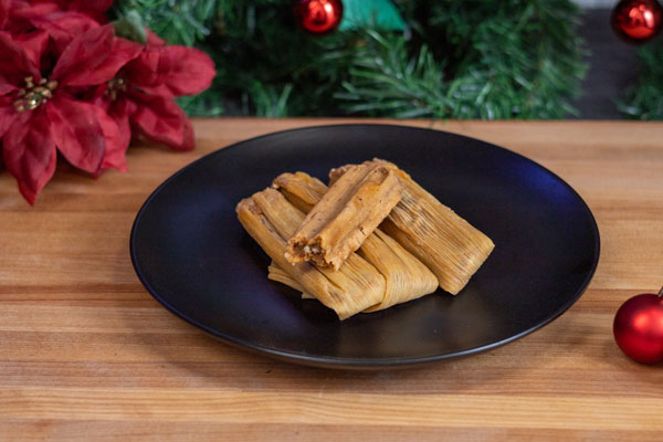Order tamales with holiday background.