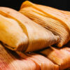 Platter of best tamales in Texas on a mexican quilt.